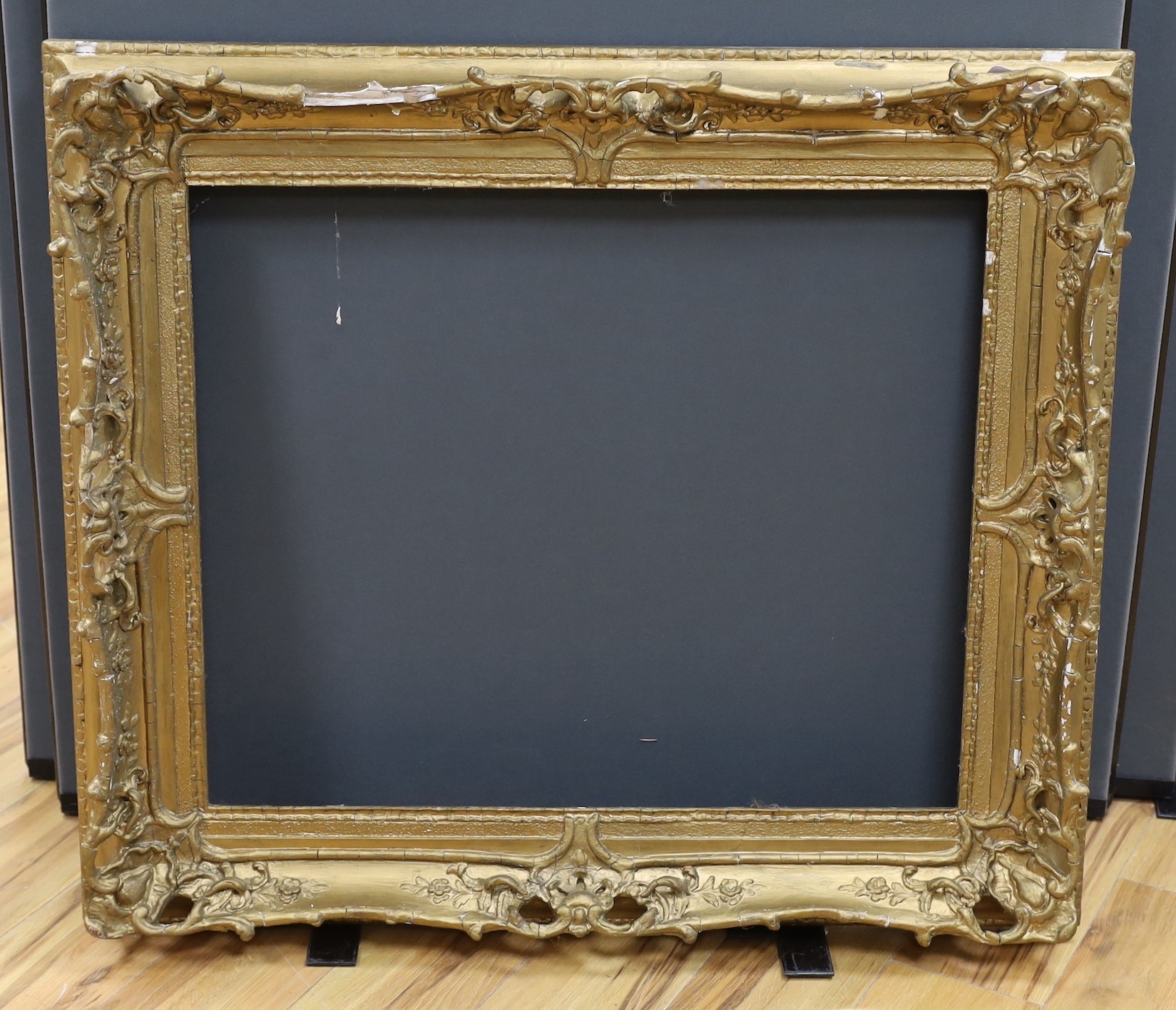 An ornate painted gilt picture frame, 90 x 100cm overall